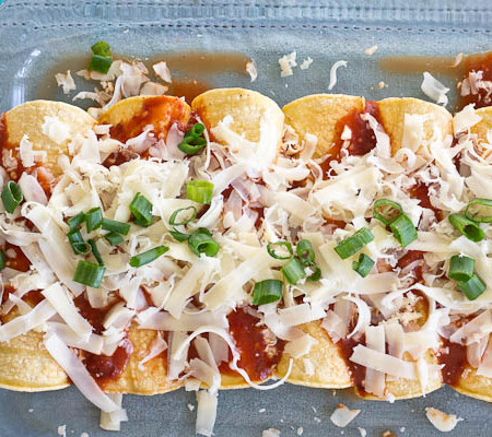 These Healthy Chicken Enchiladas are made with homemade enchilada sauce that you can feel good about. This simple weeknight meal will quickly become a family favorite. Serve with a side of beans and shredded lettuce.