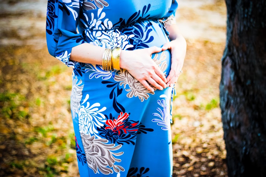 pregnant belly in blue dress