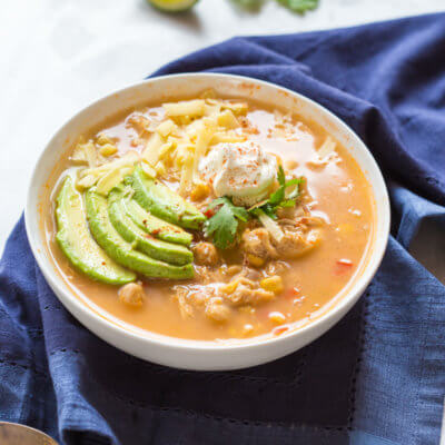 This Winter White Chicken Chili has a simple ingredient list and is made in the slow cooker!!! Hello convenience. I kept this recipe low maintenance by using pantry staples like canned beans and corn. Talk about a family friendly weeknight meal.