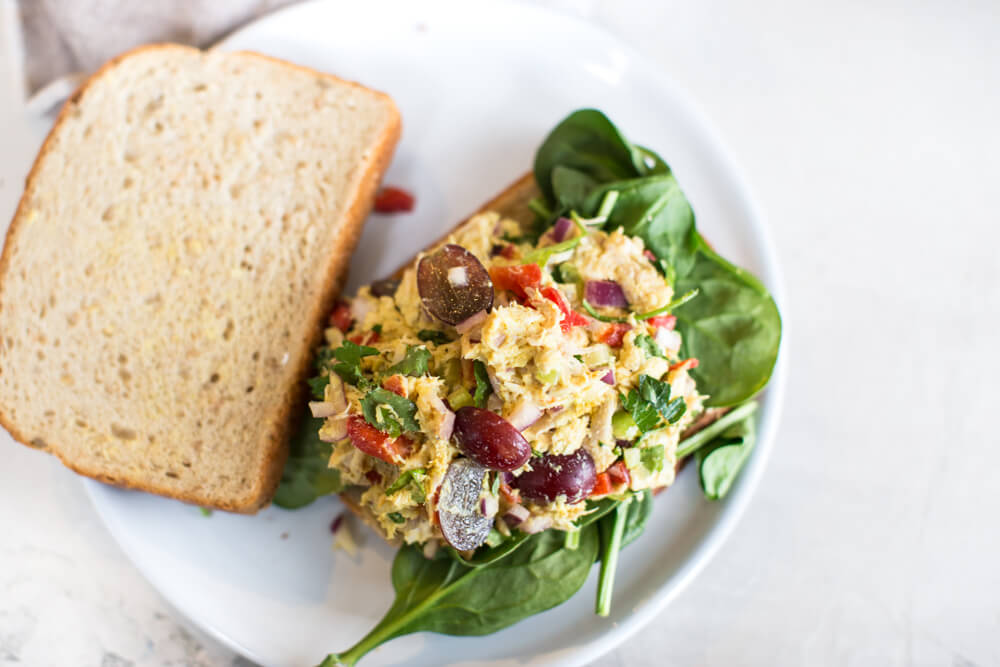 sweet and savory chicken salad with fresh veggies, red grapes, curry powder, Greek yogurt, and shredded chicken 