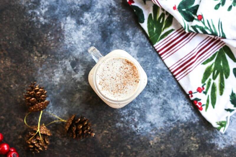 Bring the coffee shop to your house with this eggnog frappuccino that's easy to make at home-- all you need is eggnog, banana, coffee, (protein powder-- if you wish) and a blender! 