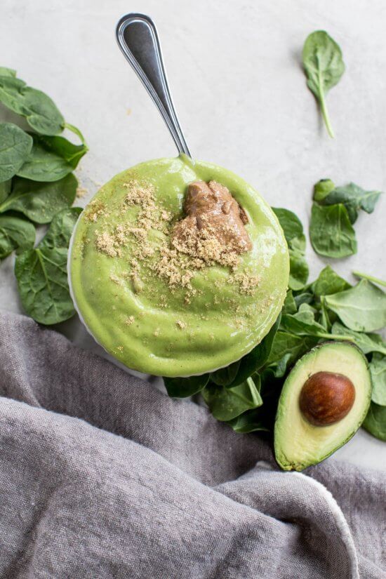 energizing breakfast recipe with spinach, banana, avocado, mango, almond butter, and flaxseed