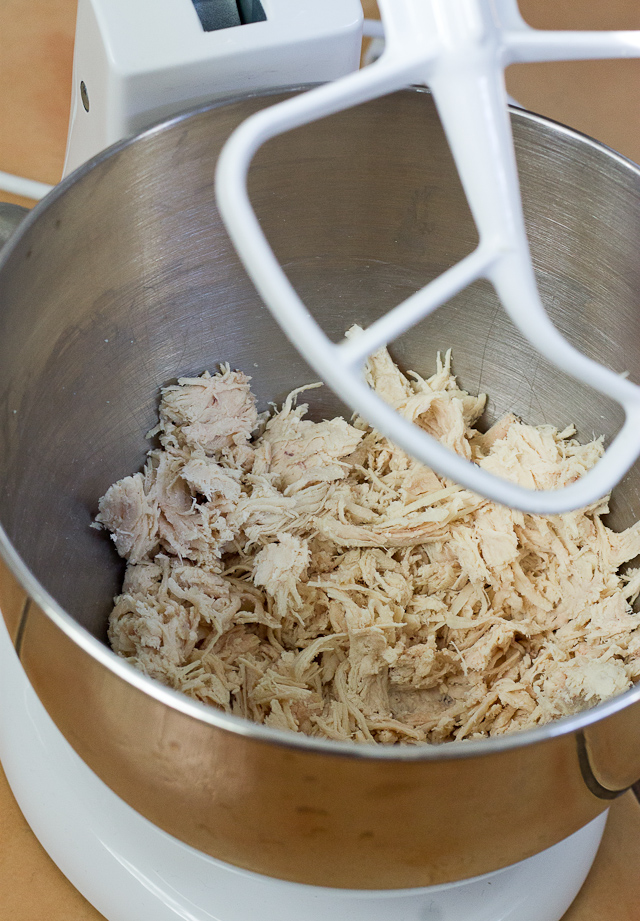 mixing bowl with shredded chicken breast 