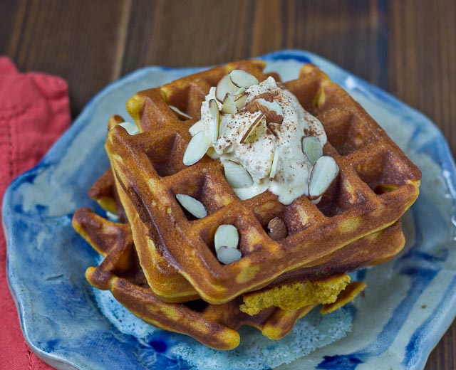 These Pumpkin Blender Waffles with Pumpkin Cream boast of fall flavors and are made in the BLENDER!! They are decadent, fluffy, and pumpkiny. Don’t make them without the Pumpkin Spice Cream… it’s melt in your mouth yum yum.