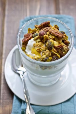 This Maple Pecan & Ginger Granola is savory and sweet with the perfect blend of fall flavors--maple, pecans, & cranberries. It's yummy topped on Greek yogurt and oatmeal!