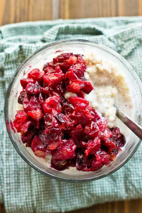Roasted Cranberries will change your life. They are all cinnamonny and mapley and topped on a comforting bowl of quinoa oatmeal! Just know, a bowl of Roasted Cranberries & Quinoa Oatmeal will be sure to give you that holiday fever.