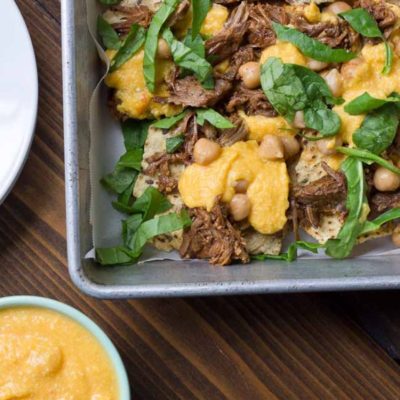 Not your mama’s nachos but these Slow Cooker Steak Nachos with Spicy Butternut Squash Queso are as flavor filled as it gets! Butternut squash makes the queso creamy with half the cheese to save fat and calories. Oh and the steak is crazy tender, perfectly seasoned and made right in the slow cooker!