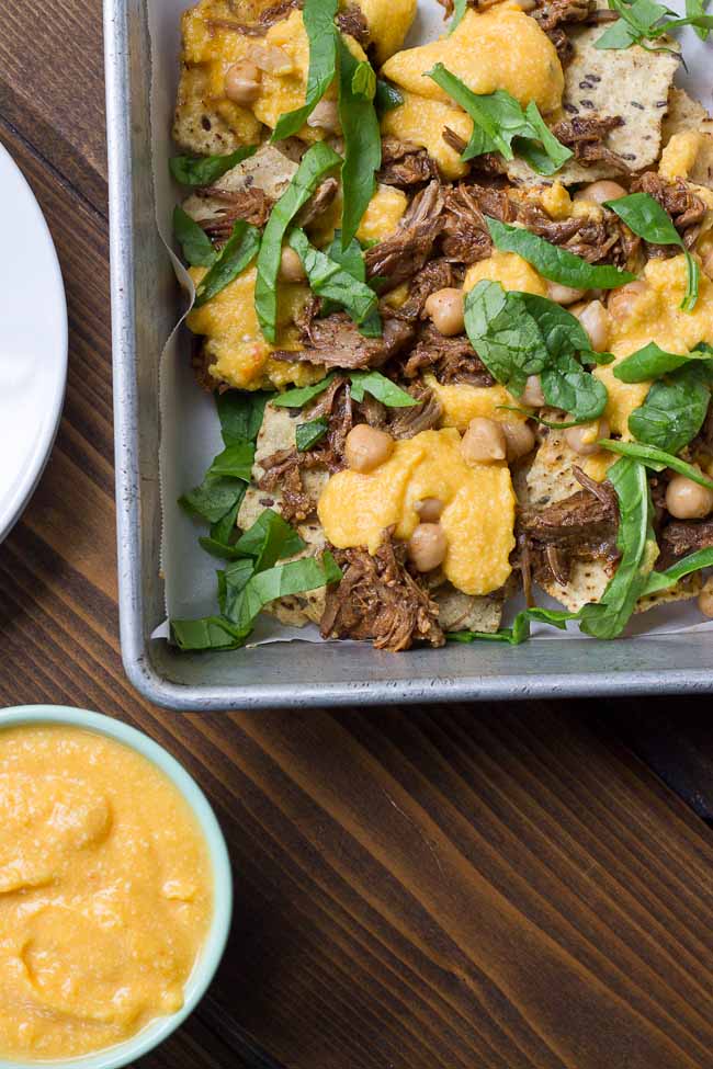 Not your mama’s nachos but these Slow Cooker Steak Nachos with Spicy Butternut Squash Queso are as flavor filled as it gets! Butternut squash makes the queso creamy with half the cheese to save fat and calories. Oh and the steak is crazy tender, perfectly seasoned and made right in the slow cooker!