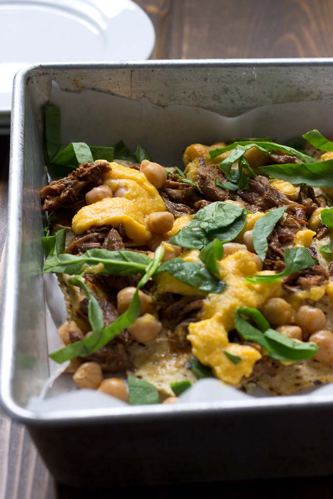 Not your mama’s nachos but these Slow Cooker Steak Nachos with Spicy Butternut Squash Queso are as flavor filled as it gets! Butternut squash makes the queso creamy with half the cheese to save fat and calories. Oh and the steak is crazy tender, perfectly seasoned and made right in the slow cooker!