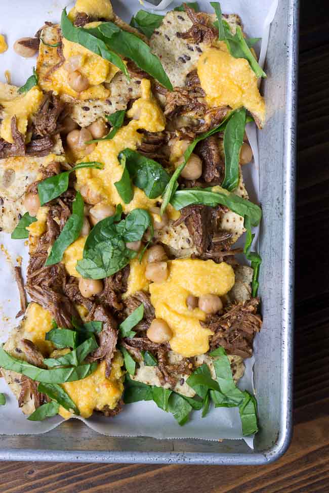 Not your mama’s nachos but these Slow Cooker Steak Nachos with Spicy Butternut Squash Queso are as flavor filled as it gets! Butternut squash makes the queso creamy with half the cheese to save fat and calories. Oh and the steak is crazy tender, perfectly seasoned and made right in the slow cooker!