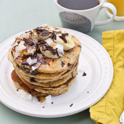 Shaved dark chocolate, smashed banana, coconut flakes, and coconut Greek yogurt = Funky Monkey Pancakes. You will melt.