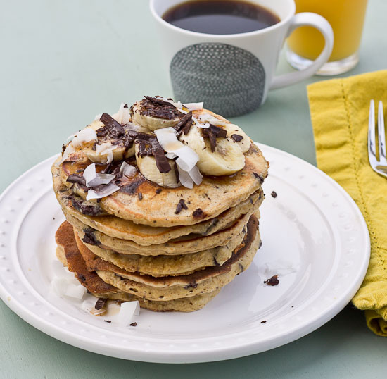 Shaved dark chocolate, smashed banana, coconut flakes, and coconut Greek yogurt = Funky Monkey Pancakes. You will melt.