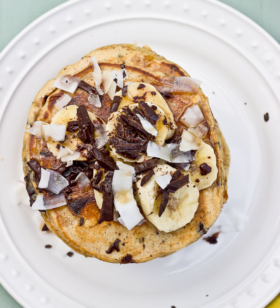 Shaved dark chocolate, smashed banana, coconut flakes, and coconut Greek yogurt = Funky Monkey Pancakes. You will melt.