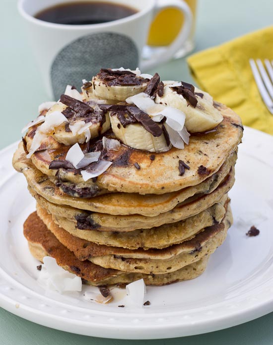 Shaved dark chocolate, smashed banana, coconut flakes, and coconut Greek yogurt = Funky Monkey Pancakes. You will melt.