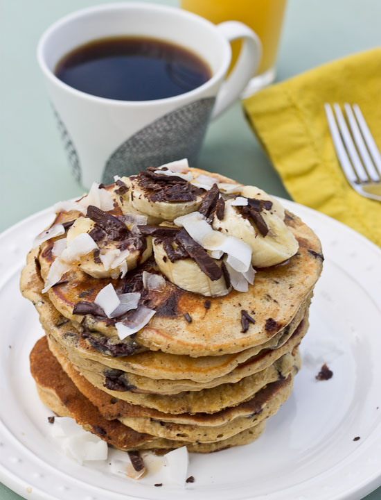 Shaved dark chocolate, smashed banana, coconut flakes, and coconut Greek yogurt = Funky Monkey Pancakes. You will melt.