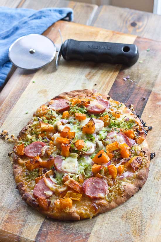 This sweet and savory pizza is loaded with the goodness of the fall season. Brussels sprouts and butternut squash make this naan pizza hearty and healthy!