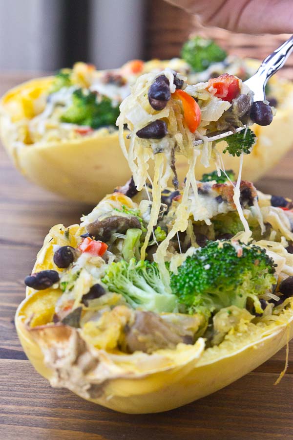 Vegetarian Spaghetti Squash Boats are the ultimate healthy comfort food made with whole simple ingredients, just right for a weeknight. You’ll be amazed at how simple they are to prepare. Bonus: these are meat and potatoes lovin' husband approved too, and that's sayin' somethin'.  | @KristinaLaRueRD