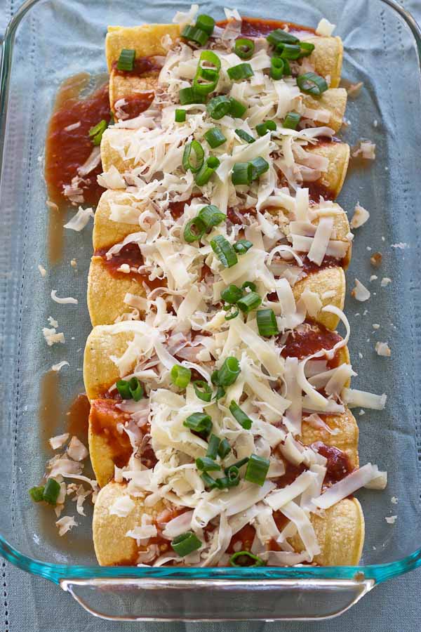 These Healthy Chicken Enchiladas are made with homemade enchilada sauce that you can feel good about. This simple weeknight meal will quickly become a family favorite. Serve with a side of beans and shredded lettuce.