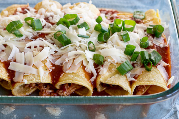 These Healthy Chicken Enchiladas are made with homemade enchilada sauce that you can feel good about. This simple weeknight meal will quickly become a family favorite. Serve with a side of beans and shredded lettuce.