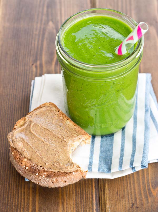 Slurp on a Ginger and Greens Smoothie made with fresh ginger, frozen fruit and 2 cups of greens!! It's super refreshing and cleansing!