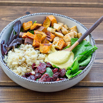 This Veggie Power Bowl topped with Cashew Honey Mustard Dressing is just what you need after a workout. It’s power-packed with quinoa, sweet potatoes, dried tart cherries, spring greens, roasted tofu, and sunflower seeds that will keep you fueled and speed recovery.