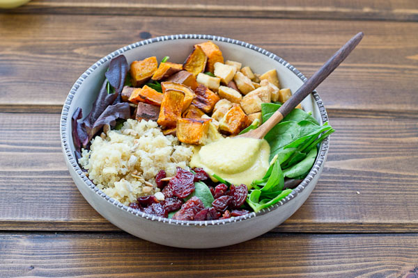 This Veggie Power Bowl topped with Cashew Honey Mustard Dressing is just what you need after a workout. It’s power-packed with quinoa, sweet potatoes, dried tart cherries, spring greens, roasted tofu, and sunflower seeds that will keep you fueled and speed recovery.