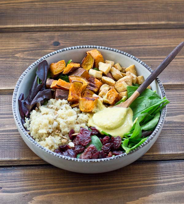 This Veggie Power Bowl topped with Cashew Honey Mustard Dressing is just what you need after a workout. It’s power-packed with quinoa, sweet potatoes, dried tart cherries, spring greens, roasted tofu, and sunflower seeds that will keep you fueled and speed recovery.