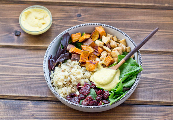 This Veggie Power Bowl topped with Cashew Honey Mustard Dressing is just what you need after a workout. It’s power-packed with quinoa, sweet potatoes, dried tart cherries, spring greens, roasted tofu, and sunflower seeds that will keep you fueled and speed recovery.