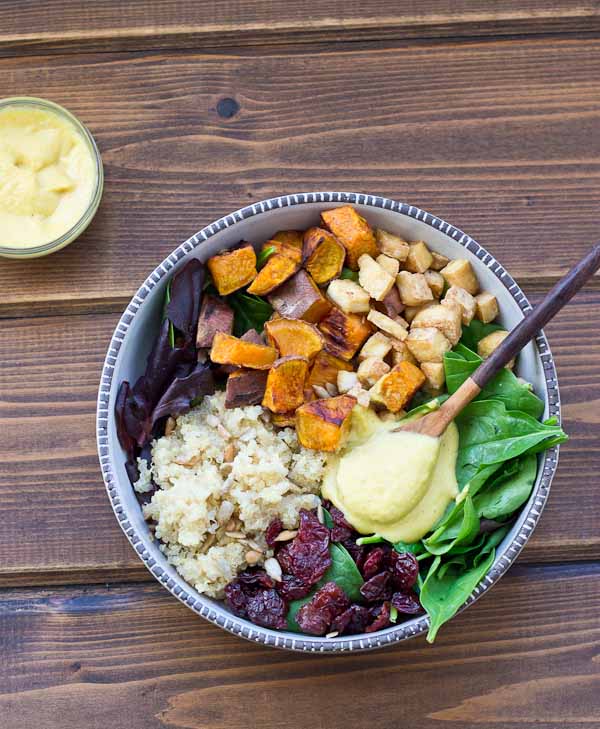 This Veggie Power Bowl topped with Cashew Honey Mustard Dressing is just what you need after a workout. It’s power-packed with quinoa, sweet potatoes, dried tart cherries, spring greens, roasted tofu, and sunflower seeds that will keep you fueled and speed recovery.