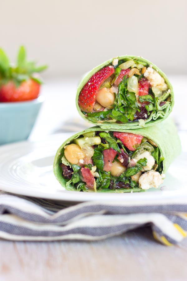 This Strawberry Salad Wrap is bursting with all the goodness of the Spring season. Sweet strawberries, crisp cucumbers and romaine lettuce tossed with a zesty balsamic vinaigrette and folded into a spinach wrap. Can't get enough. 