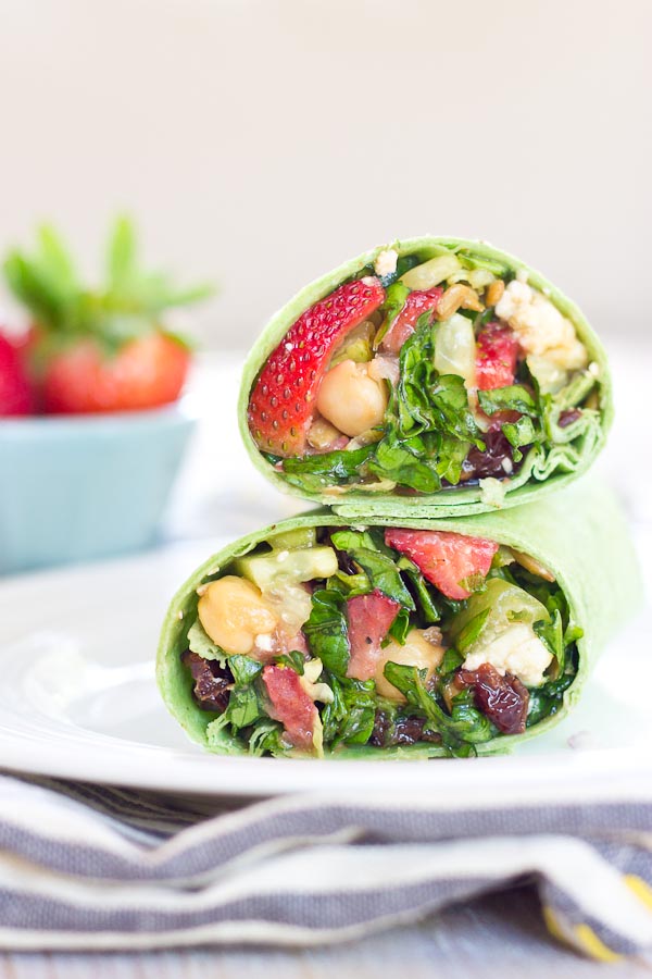 This Strawberry Salad Wrap is bursting with all the goodness of the Spring season. Sweet strawberries, crisp cucumbers and romaine lettuce tossed with a zesty balsamic vinaigrette and folded into a spinach wrap. Can't get enough. 