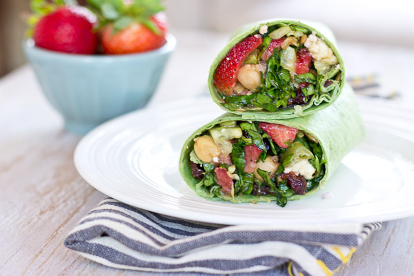 This Strawberry Salad Wrap is bursting with all the goodness of the Spring season. Sweet strawberries, crisp cucumbers and romaine lettuce tossed with a zesty balsamic vinaigrette and folded into a spinach wrap. Can't get enough. 