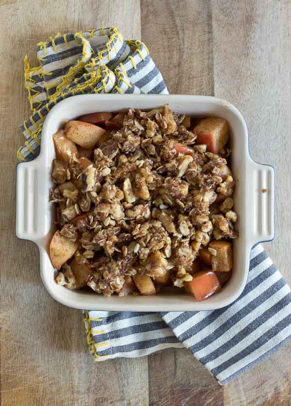 This "No Bake" Skillet Apple Crisp is made with whole ingredients like apples, walnuts, coconut, and oats.... right on your stovetop, no baking required. The best part, this dessert is healthy enough to eat for breakfast... well we did anyway! Vegan, Dairy Free. Gluten Free. 
