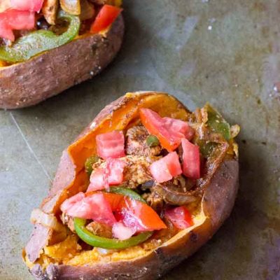 To all the weeknight dinner lovers out there, these Chicken Fajita Stuffed Sweet Potatoes are for you. Fajita grilled chicken, peppers, and onions smothered between a creamy baked sweet potato goodness. This is what we call healthy comfort food.