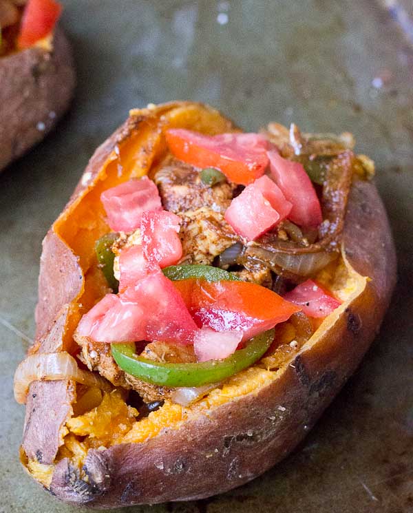 To all the weeknight dinner lovers out there, these Chicken Fajita Stuffed Sweet Potatoes are for you. Fajita grilled chicken, peppers, and onions smothered between a creamy baked sweet potato goodness. This is what we call healthy comfort food. 