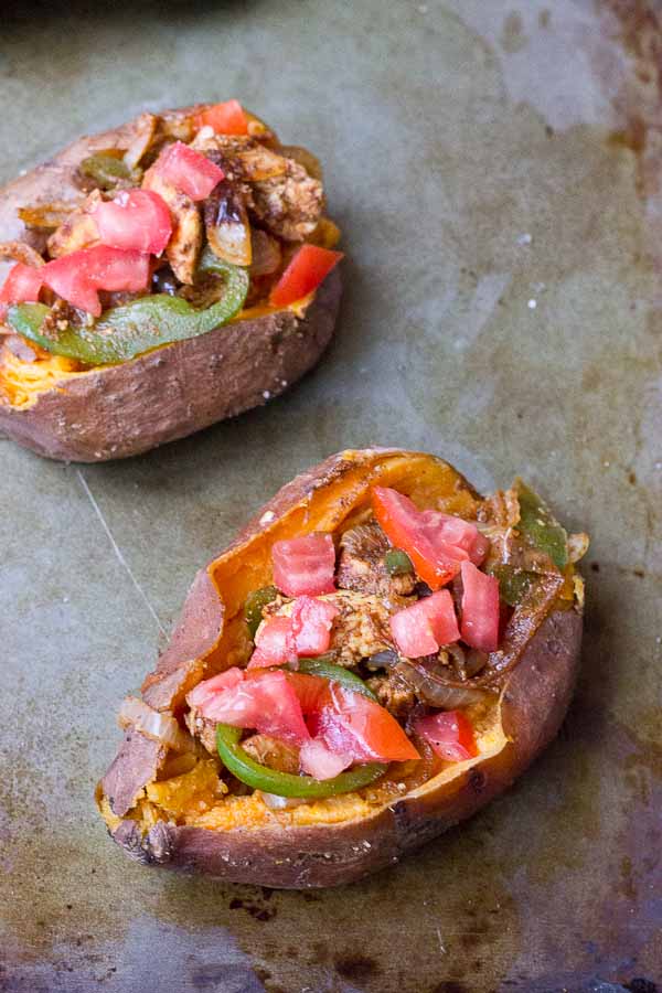 To all the weeknight dinner lovers out there, these Chicken Fajita Stuffed Sweet Potatoes are for you. Fajita grilled chicken, peppers, and onions smothered between a creamy baked sweet potato goodness. This is what we call healthy comfort food. 
