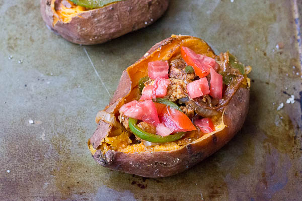 To all the weeknight dinner lovers out there, these Chicken Fajita Stuffed Sweet Potatoes are for you. Fajita grilled chicken, peppers, and onions smothered between a creamy baked sweet potato goodness. This is what we call healthy comfort food. 