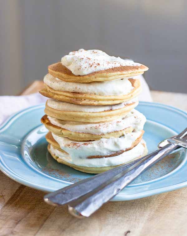 Impress your family and house guests with a stack of festive Eggnog Pancakes topped with creamy Eggnog Whipped Cream. | @KristinaLaRueRD | loveandzest.com