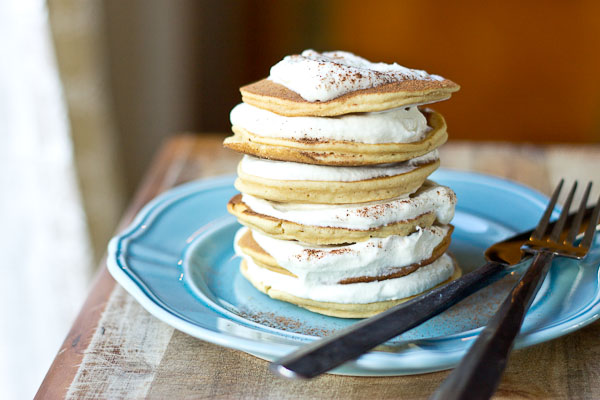 Impress your family and house guests with a stack of festive Eggnog Pancakes topped with creamy Eggnog Whipped Cream. | @KristinaLaRueRD | loveandzest.com