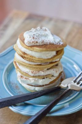 Impress your family and house guests with a stack of festive Eggnog Pancakes topped with creamy Eggnog Whipped Cream. | @KristinaLaRueRD | loveandzest.com