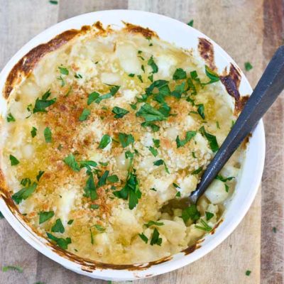 This Cauliflower "Mac" n Cheese, made with gnocchi instead of macaroni is so creamy and so cheesy, it's hard to resist eating it all up! Have a bowl of this "Mac n Cheese" and eat your veggies too!