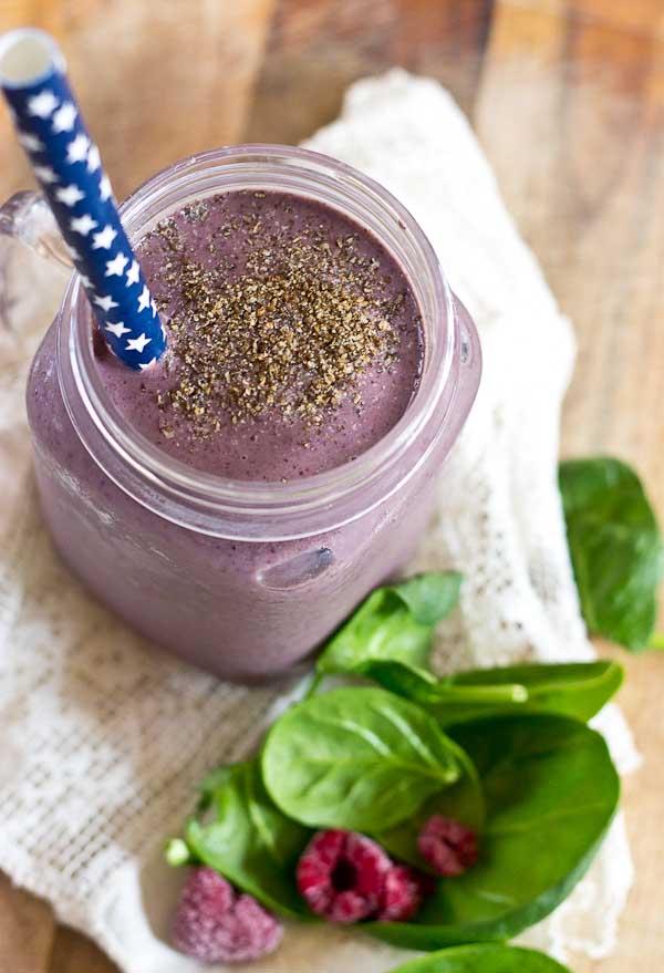 Get this Superfood Smoothie crammed packed with good for you stuff like chia seeds, ground flax, loads of berries, almond butter, and spinach. I love the purple color of this green smoothie! You'd never know there were greens hidden in there!