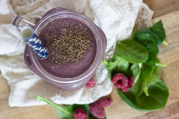 Get this Superfood Smoothie crammed packed with good for you stuff like chia seeds, ground flax, loads of berries, almond butter, and spinach. I love the purple color of this green smoothie! You'd never know there were greens hidden in there!