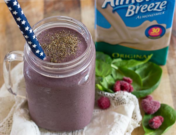 Get this Superfood Smoothie crammed packed with good for you stuff like chia seeds, ground flax, loads of berries, almond butter, and spinach. I love the purple color of this green smoothie! You'd never know there were greens hidden in there!