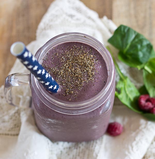 Get this Superfood Smoothie crammed packed with good for you stuff like chia seeds, ground flax, loads of berries, almond butter, and spinach. I love the purple color of this green smoothie! You'd never know there were greens hidden in there!