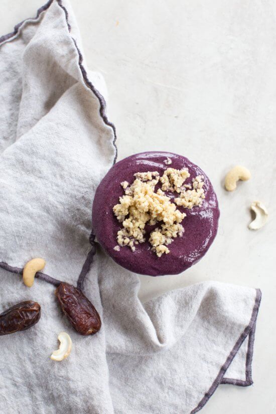 vegan blueberry smoothie with wild blueberries, raw cashes, almond milk, and dates