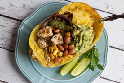 These Chicken Burrito Spaghetti Squash Bowls are protein packed and gluten free. I love this veggie filled take on this popular Mexican dish. Everything is better in a {spaghetti squash} bowl!