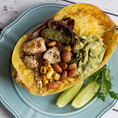 These Chicken Burrito Spaghetti Squash Bowls are protein packed and gluten free. I love this veggie filled take on this popular Mexican dish. Everything is better in a {spaghetti squash} bowl!
