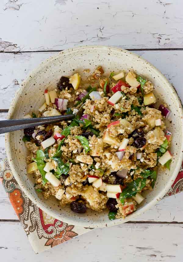 Make a batch of this Cinnamon Apple Quinoa Salad to eat during the week for a quick and healthy lunch. This grain salad made with quinoa, apples, tart cherries, spinach and feta makes you feel super healthy with every bite. Serve on a bed of lettuce for an even bigger nutrition boost.