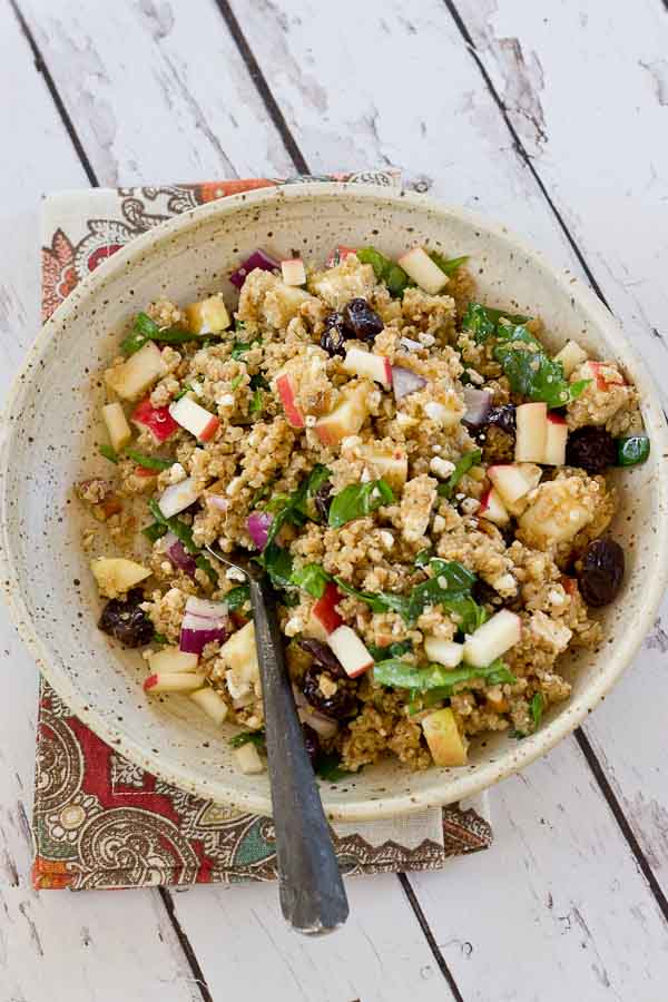 Make a batch of this Cinnamon Apple Quinoa Salad to eat during the week for a quick and healthy lunch. This grain salad made with quinoa, apples, tart cherries, spinach and feta makes you feel super healthy with every bite. Serve on a bed of lettuce for an even bigger nutrition boost.